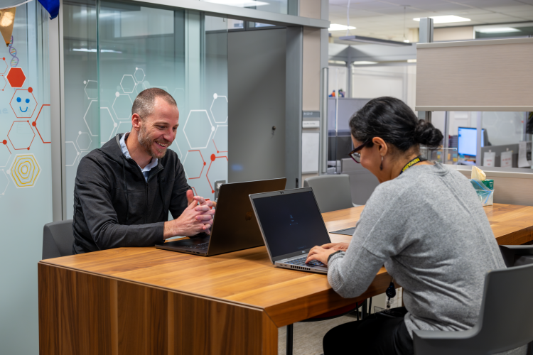 Dr. Daniel Hovelson consults with Dr. Suguna Narayan.